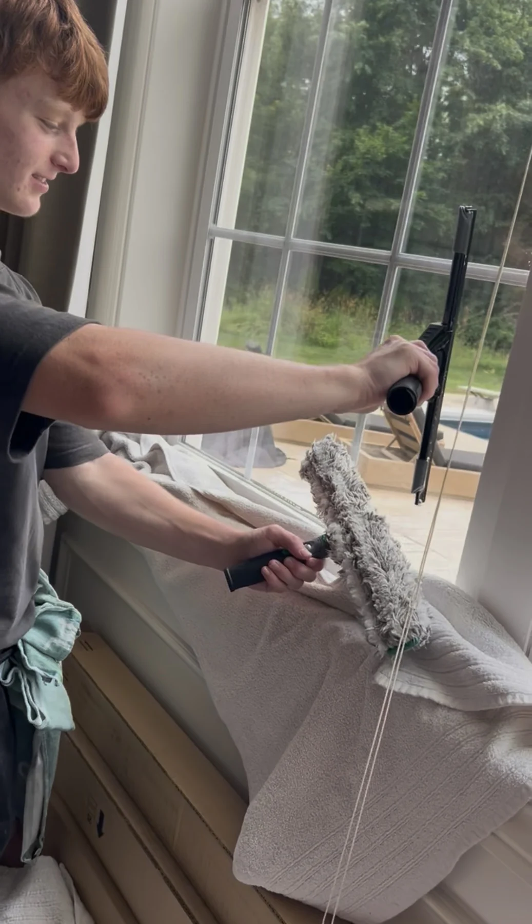 Motion Washing cleaning an interior window with a mop and squeegee